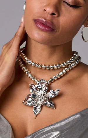 models wearing statement silver flower necklace